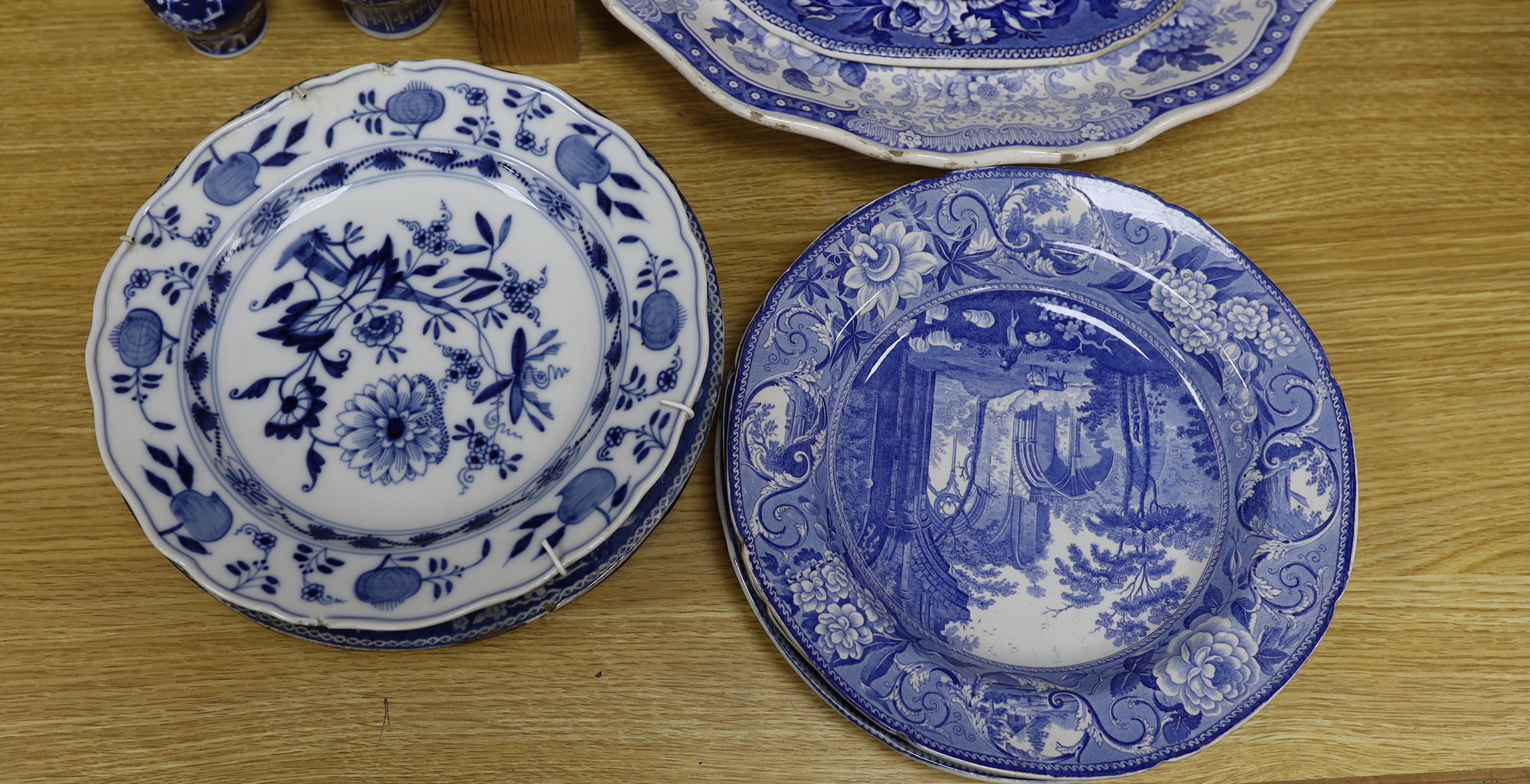An early 19th century John Meir and Sons blue and white printed 'Fairy Villas' meat dish together with a collection of Staffordshire and other blue and white dishes and two baluster jars and covers, the largest 50cm wide
